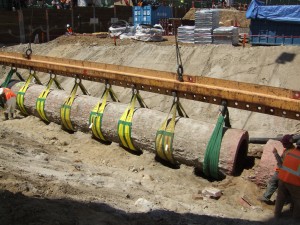 large drainage tube constructed of bricks being raised from the ground