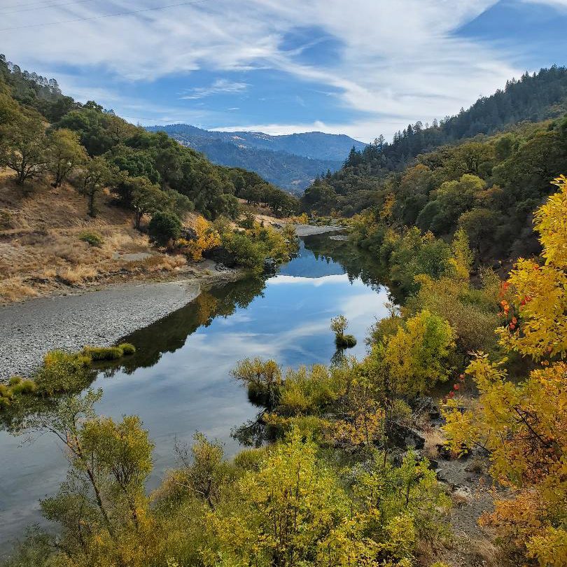 Eel River with trees and mountainous scenery