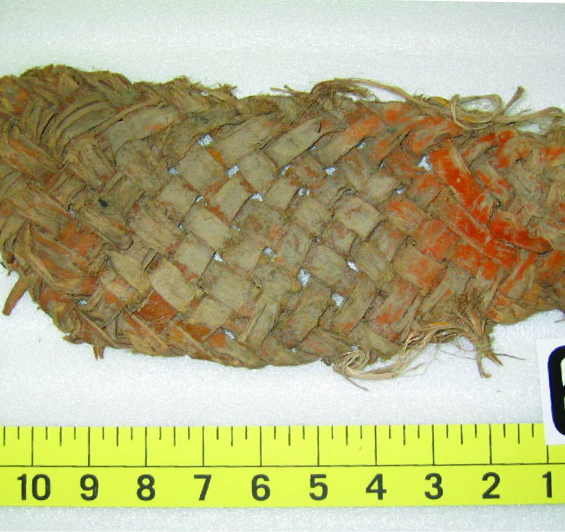 An ancient yucca sandal with a measuring tape